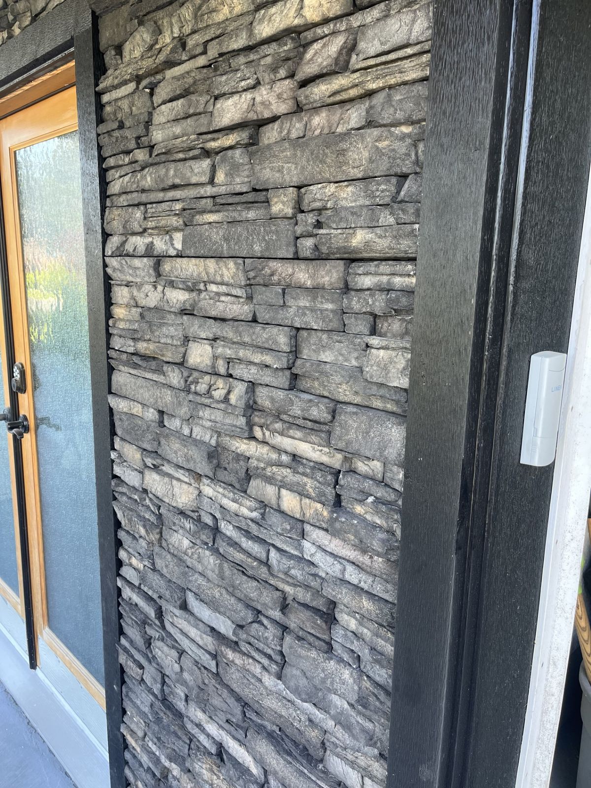Stone cladding and door trim detail