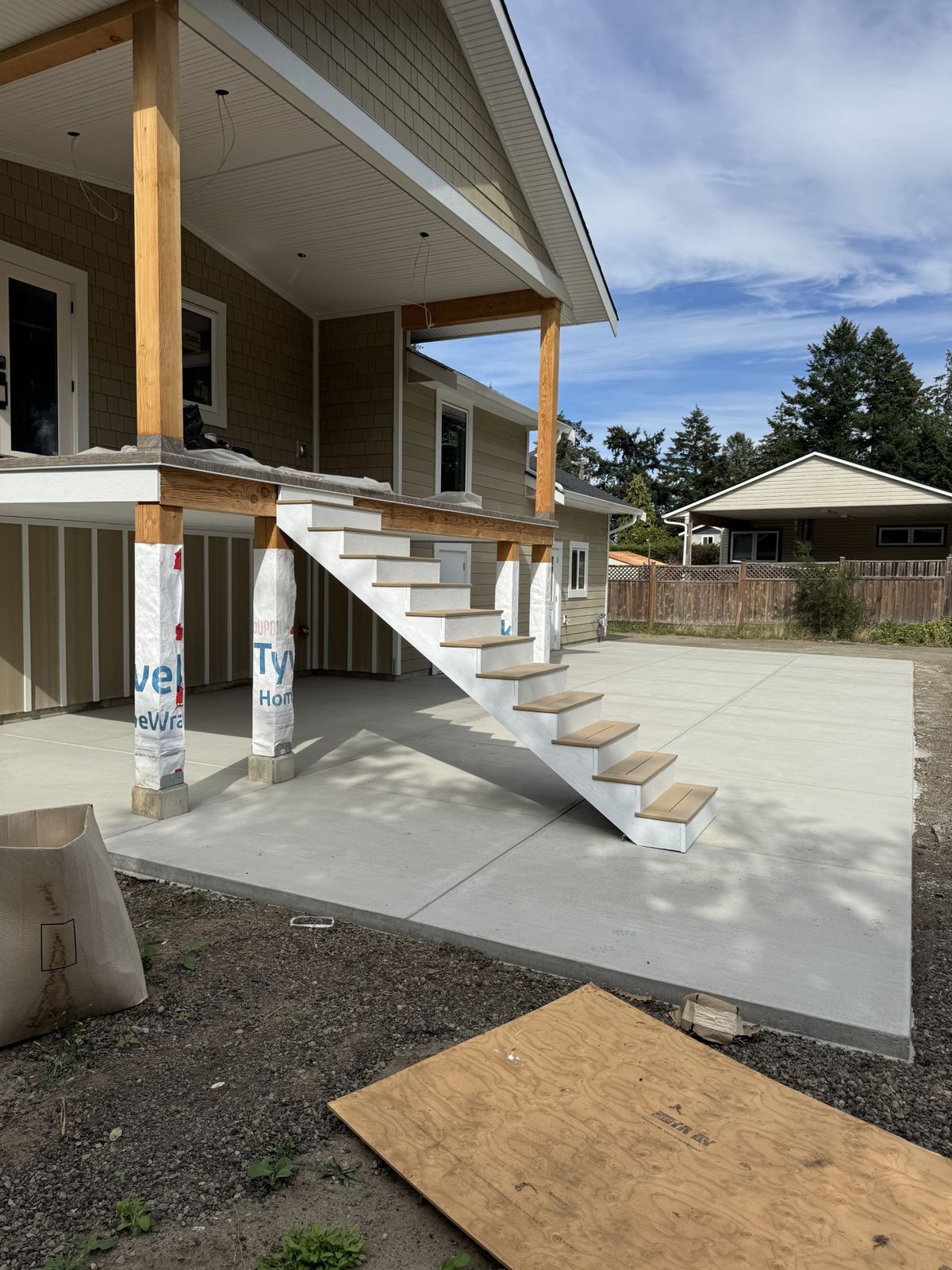New exterior stairs on a concrete pad